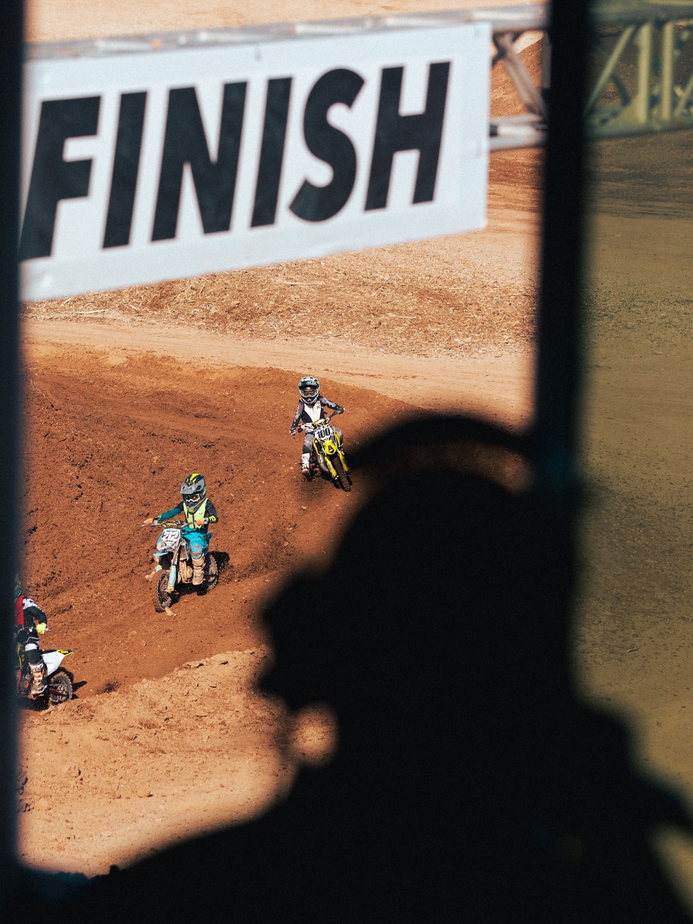 AZ Open racers framed beneath the finish sign